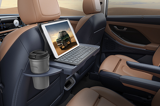 Front row seatback table with IT device holder & retractable cup-holder