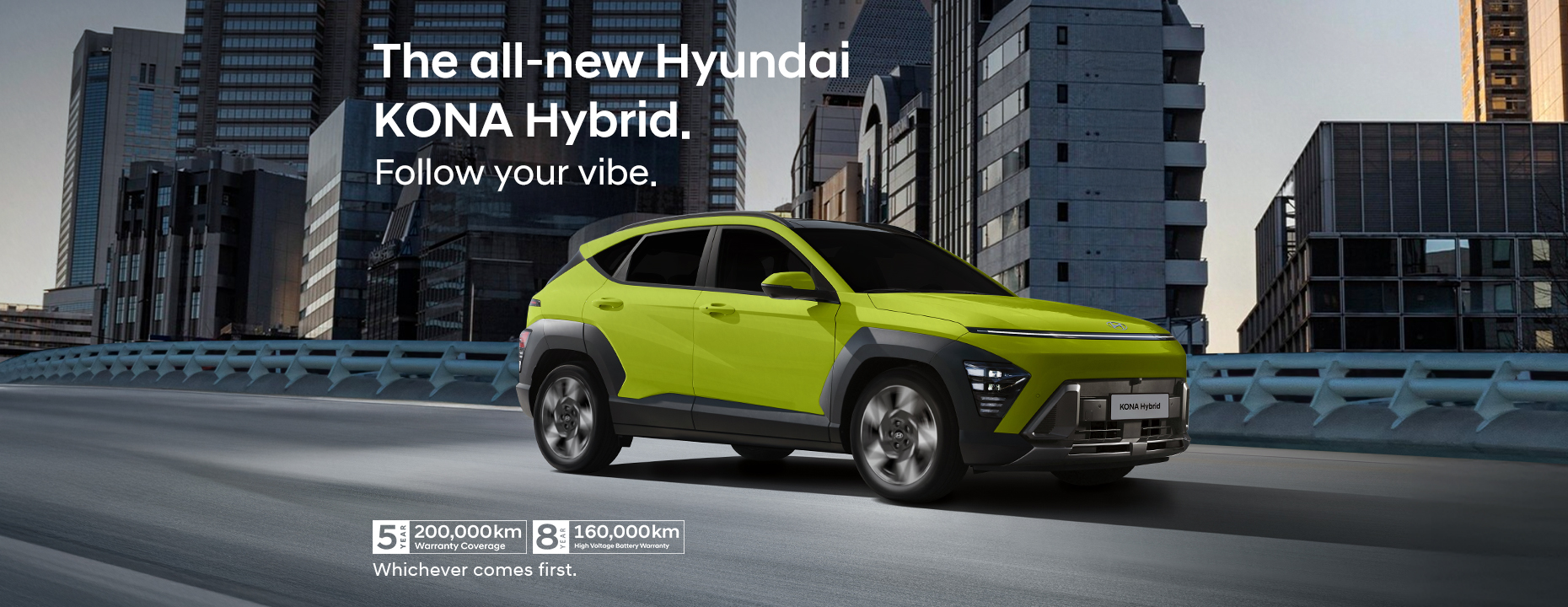 Running shot of the all-new KONA Hybrid on a bridge