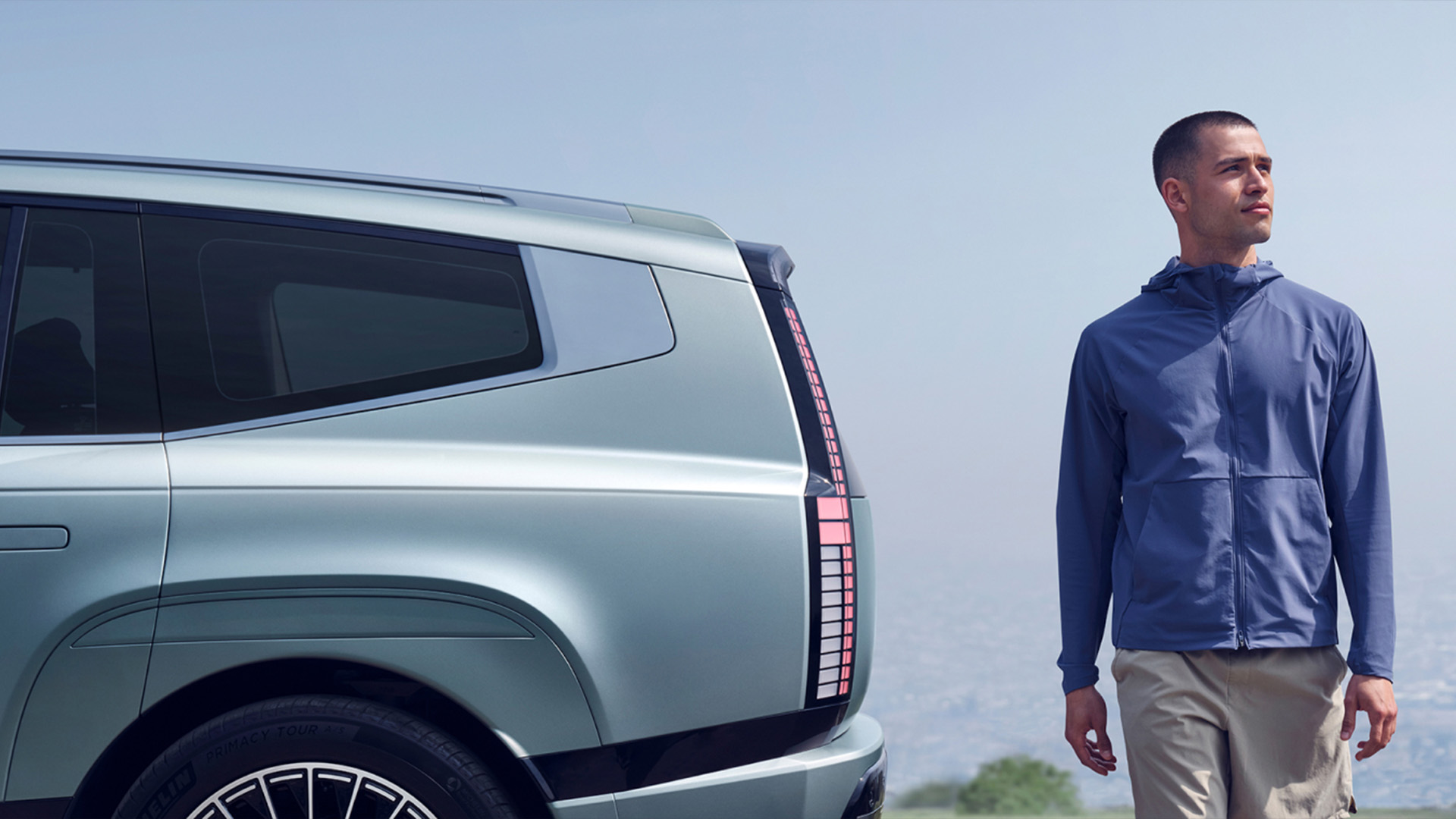 Side view of IONIQ 9 with model