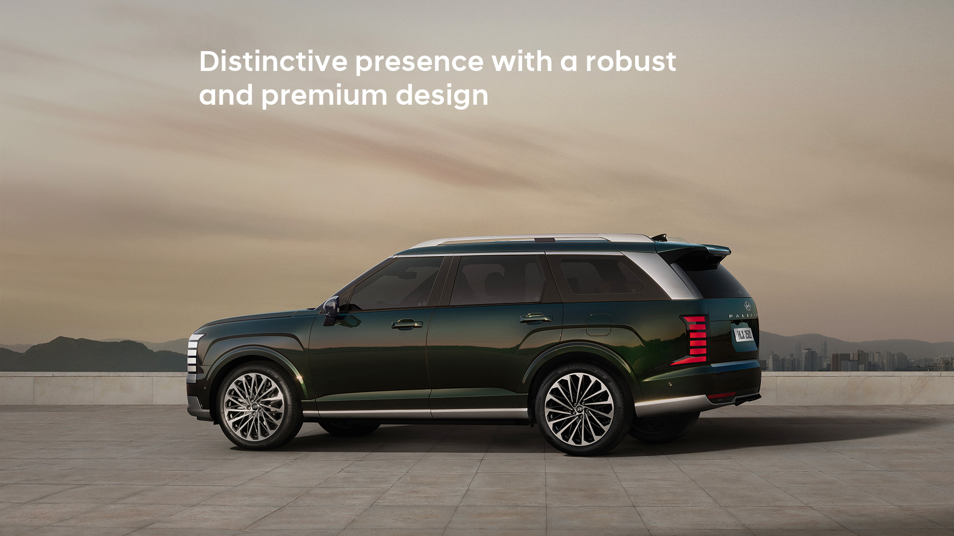 The all-new PALISADE side view, with city skyline