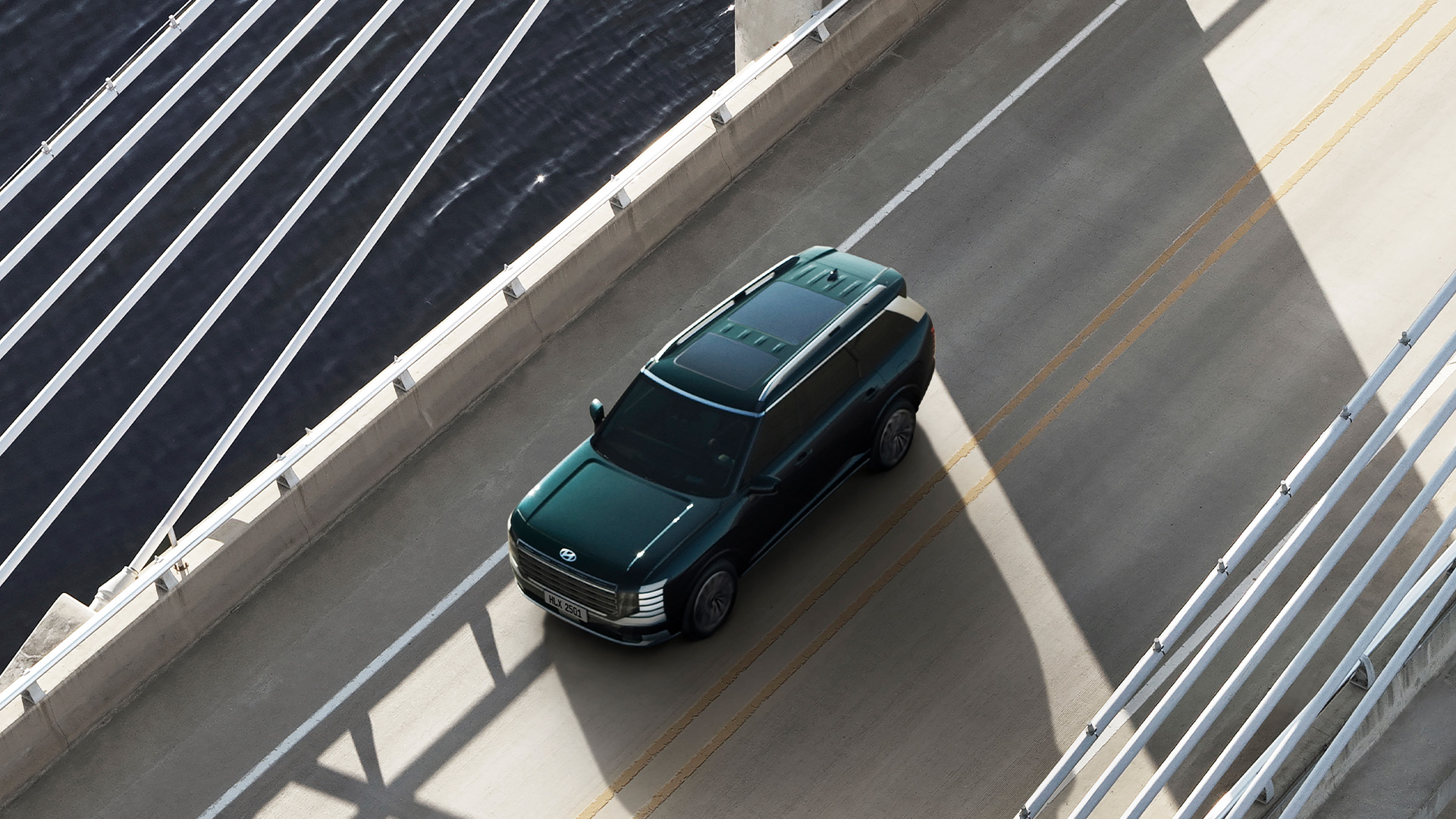 Bird's eye view of the all-new PALISADE, driving on the road