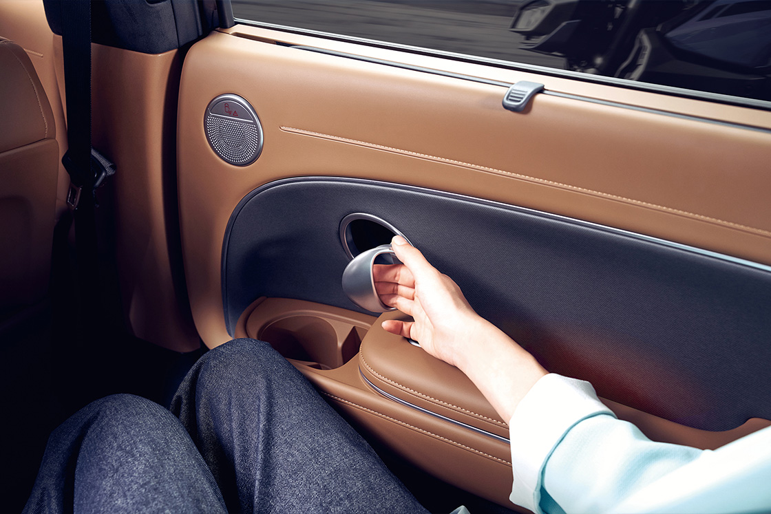 Close-up of the a person opening the door in the 2nd-row