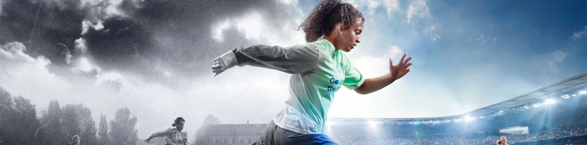 Woman footballer running from an 1890s pitch in black and white toward the well-lit stadium of a 2023 Women’s World Cup™ match.