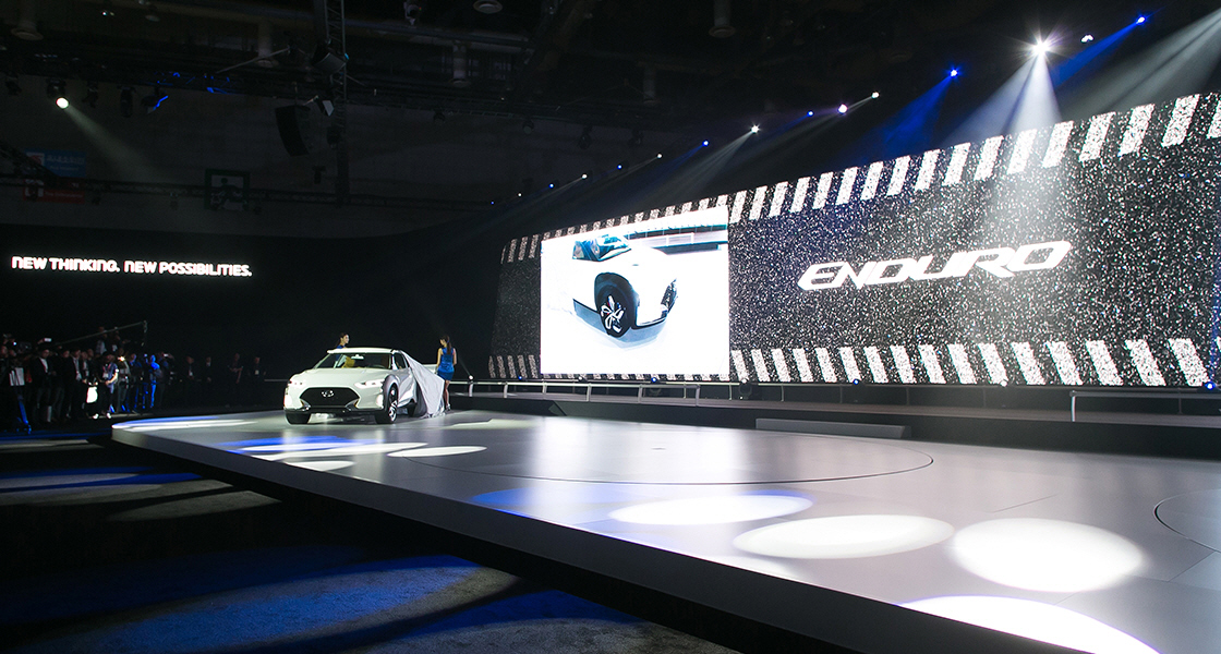 Panoramic view of unveiled 2015 Enduro car exhibited on a stage