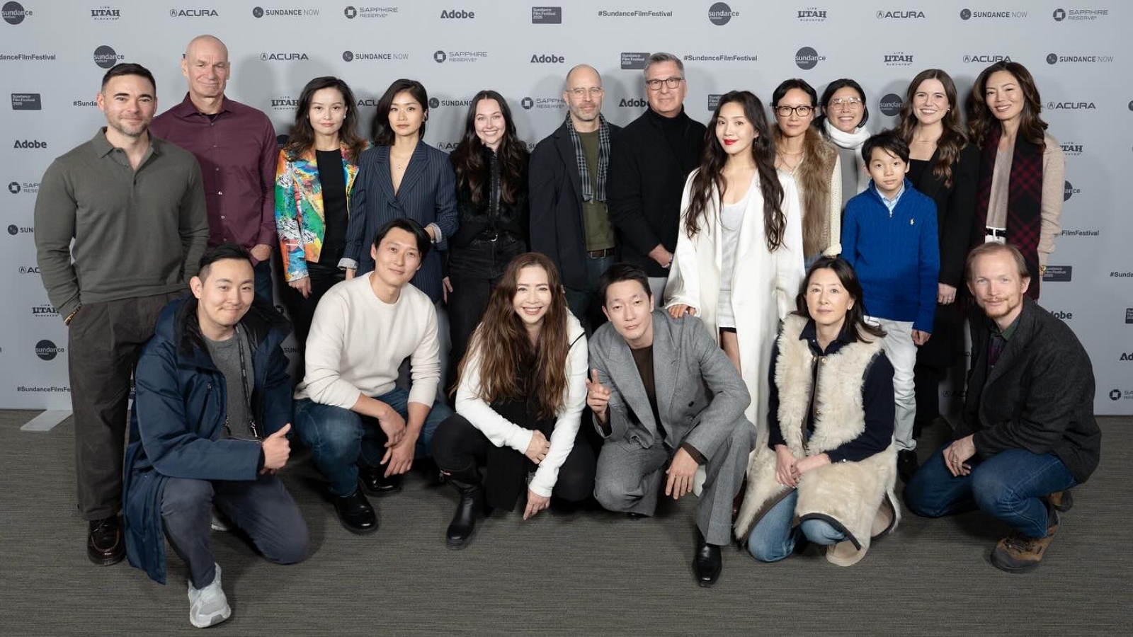 Front row, fourth from the left: actor Son Sukku; rear row, sixth from the right: actress Moon Choi; rear row, fifth from the right: director Stephanie Ahn.