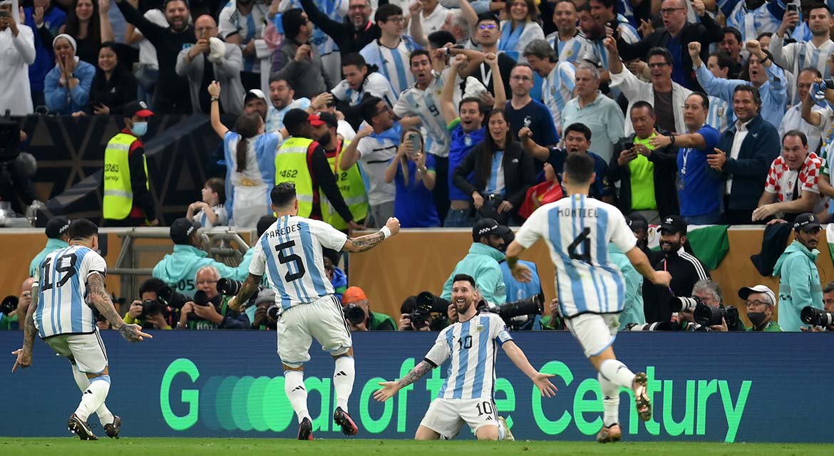 Players celebrate a goal during FIFA World Cup Qatar 2022™, with Hyundai Motor’s “Goal of the Century” campaign message displayed in the background.