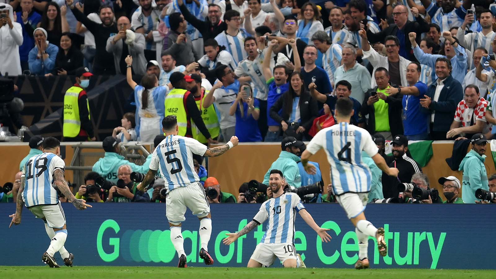 Players celebrate a goal during FIFA World Cup Qatar 2022™, with Hyundai Motor’s “Goal of the Century” campaign message displayed in the background.